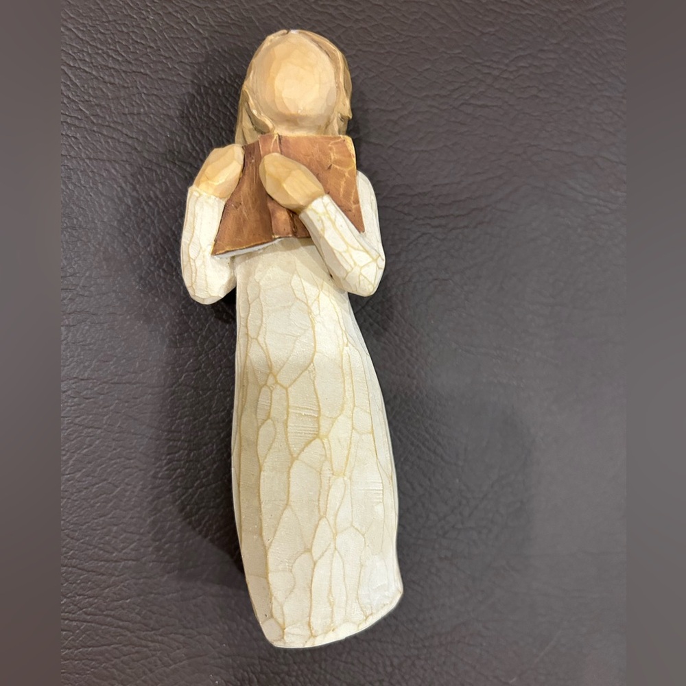 Elegant Figurine with Book